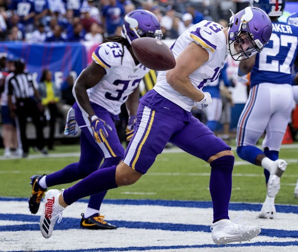 Minnesota Vikings receiver Adam Thielen celebrated after a touchdown in the second quarter.