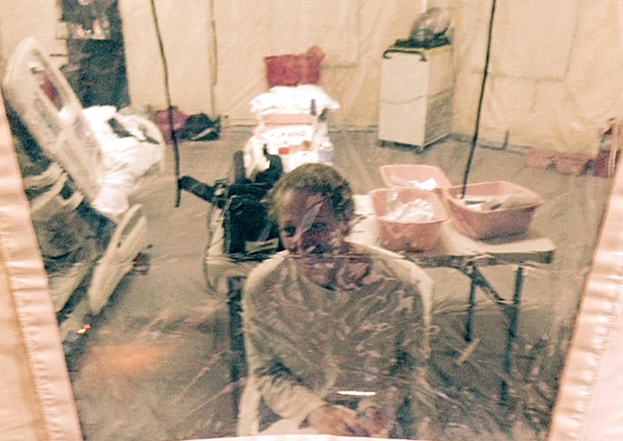 This Sunday, Oct. 26, 2014 photo provided by attorney Steven Hyman shows nurse Kaci Hickox in an isolation tent at University Hospital in Newark, N.J., where she was quarantined initially.