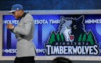Karl-Anthony Towns walks off stage after being selected first overall by the Wolves in 2015.