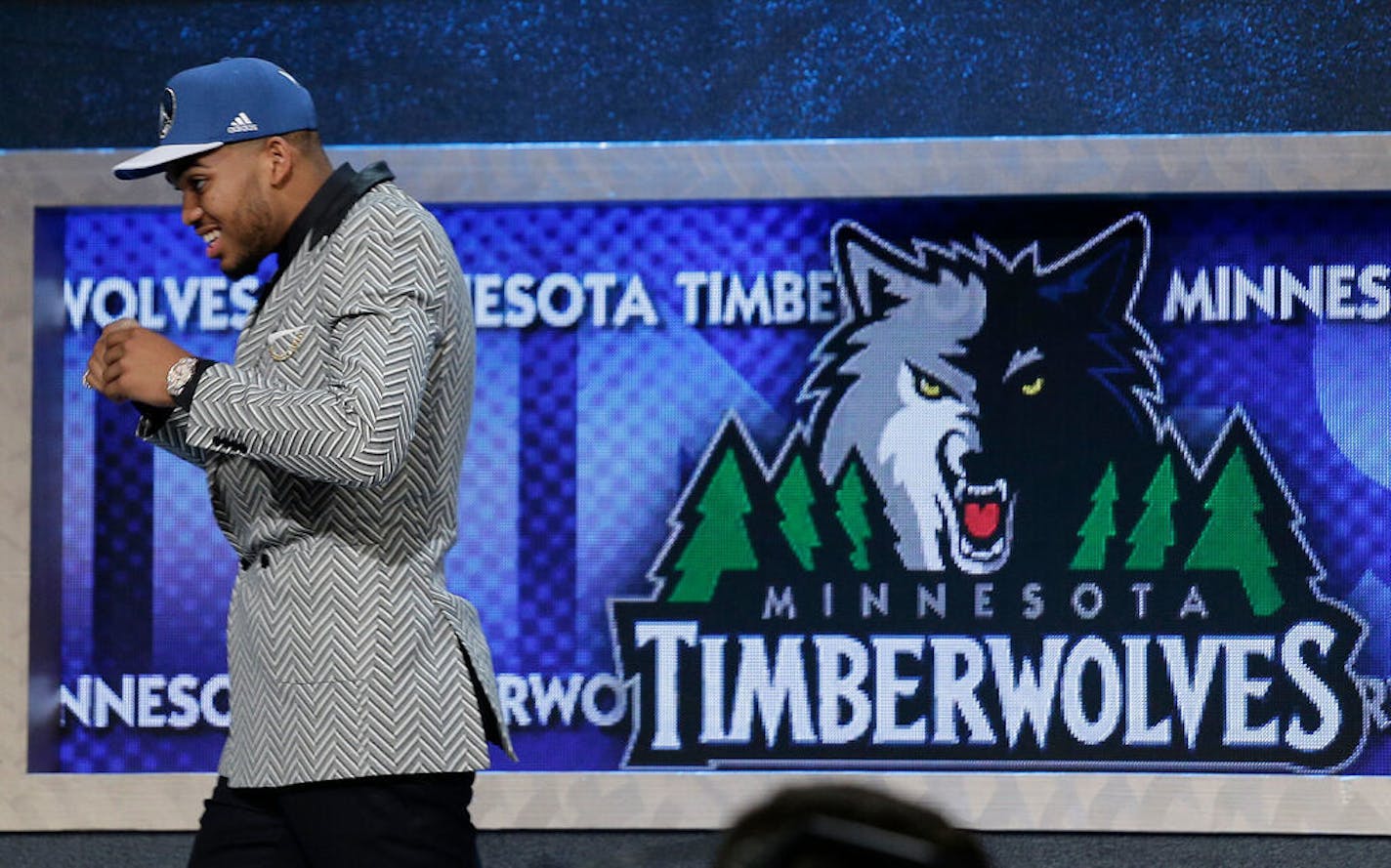 Karl-Anthony Towns walks off stage after being selected first overall by the Wolves in 2015.