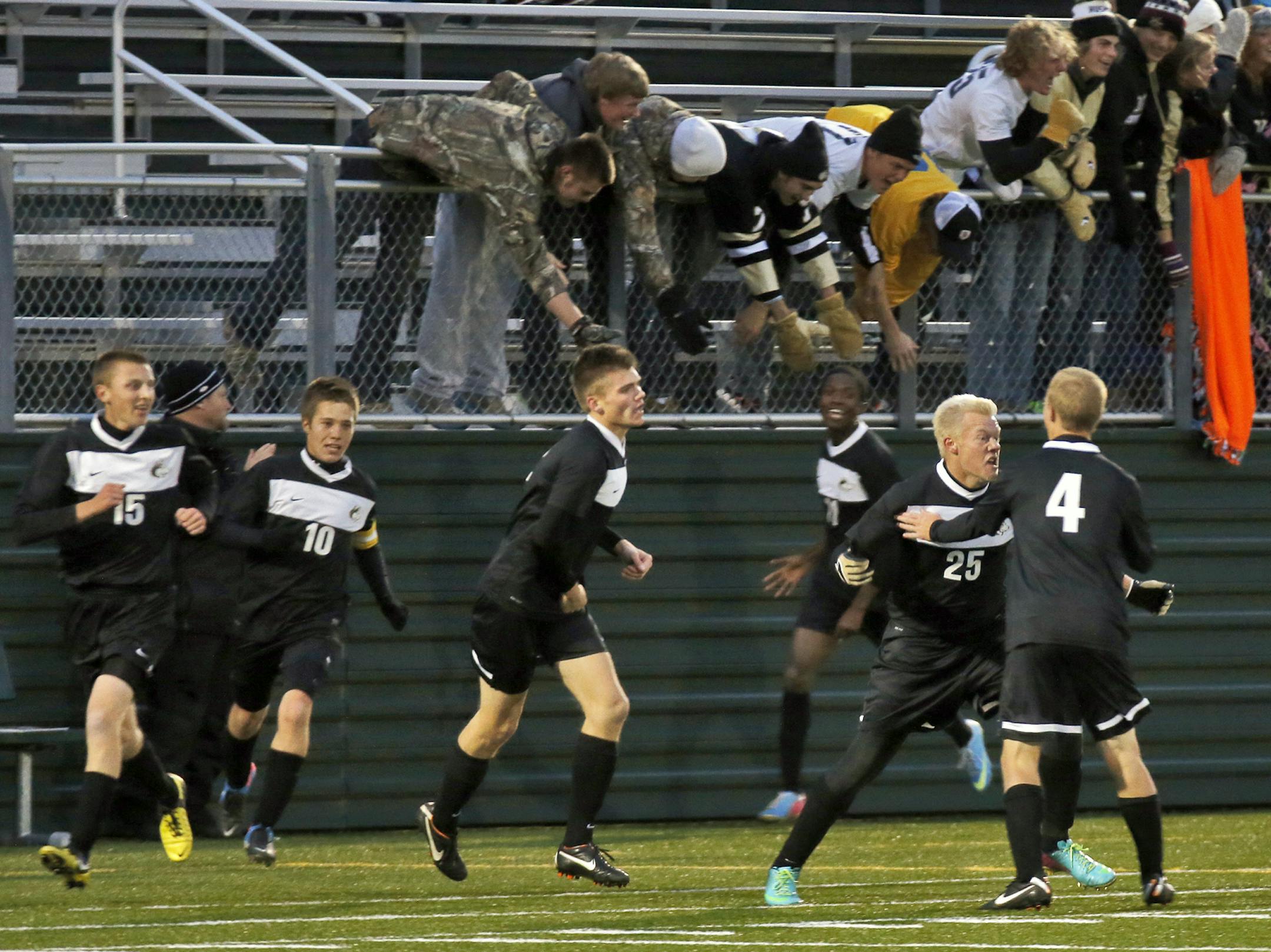 Boys soccer quarterfinals. Andover players celebrated after with fans after Andrew Bird (25) scored a goal in first half action. Andover beat Minnespolis Southwest 2-1. (MARLIN LEVISON/STARTRIBUNE(mlevison@startribune.com)
