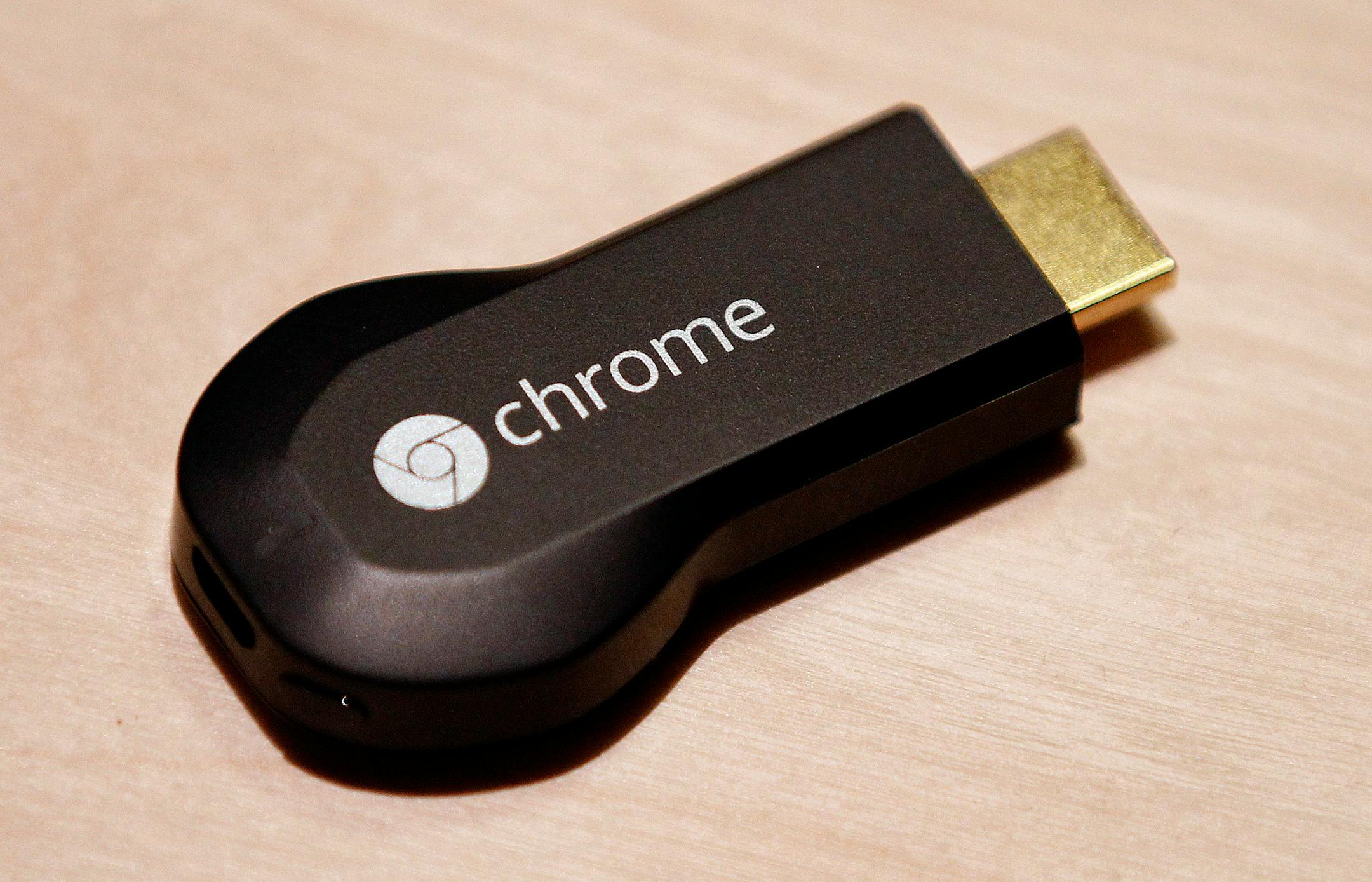 The new Google ChromeCast is displayed for a photograph during an event in San Francisco, California, U.S., on Wednesday, July 24, 2013. Google Inc., owner of the world�s most popular search engine, today unveiled an updated version of its Nexus 7 tablet as it steps up efforts against rivals such as Apple Inc. and Microsoft Corp. Photographer: Tony Avelar/Bloomberg