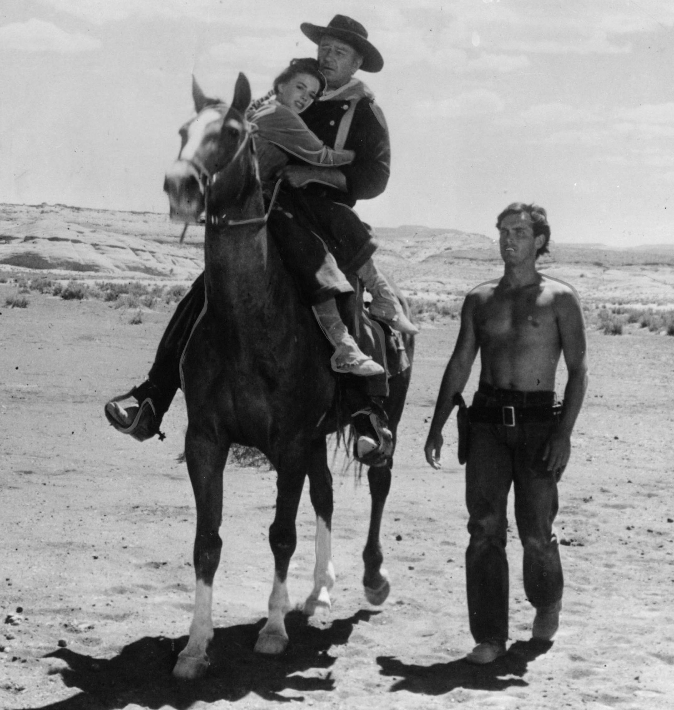 John Wayne (center, with hat) stars in the movie "The Searchers." File photo.