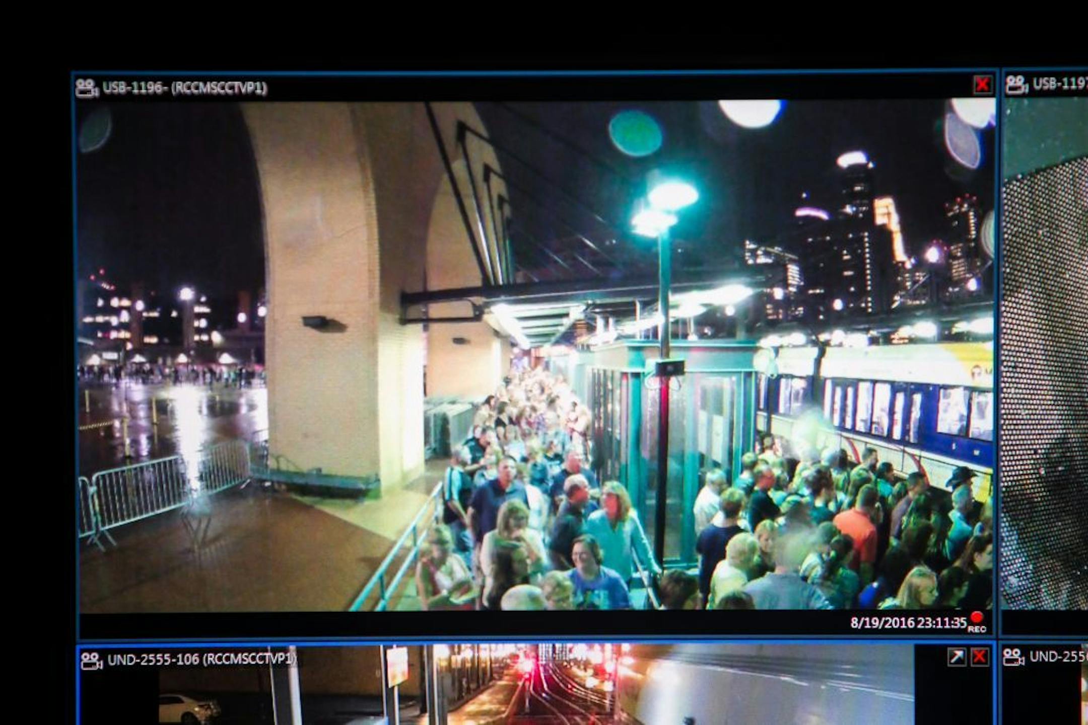 Concertgoers waited in line to board a Metro Transit train outside U.S. Bank Stadium on Aug. 19, after the first big event at the stadium, where the Vikings play their home games. The images were seen through a security camera monitor at the Metro Transit Rail Control Center.