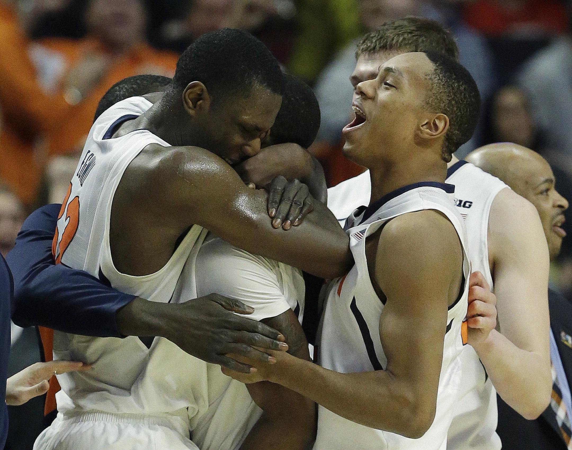 Illinois' Brandon Paul is swarmed by teammates after making the game-winning shot