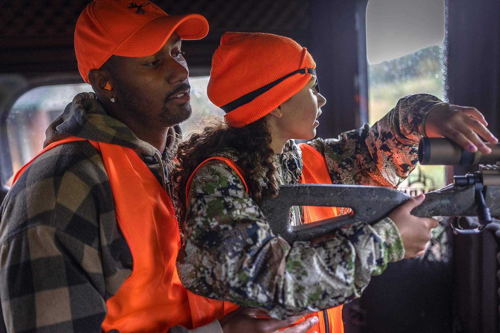 Trae Waynes practiced shooting with his daughter Layla, 7, before her first hunt at their hunting camp Oct. 6.