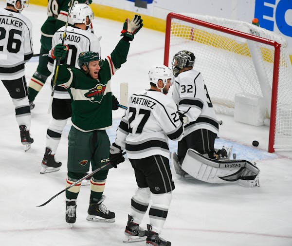The Wild's Gerald Mayhew had reason to celebrate after scoring a goal past Los Angeles Kings goalie Jonathan Quick in the first period.