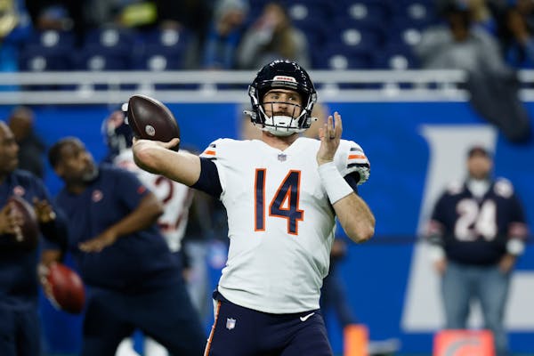 Chicago Bears quarterback Nathan Peterman throws during pregame of an NFL football game against the Detroit Lions, Sunday, Jan. 1, 2023, in Detroit. (