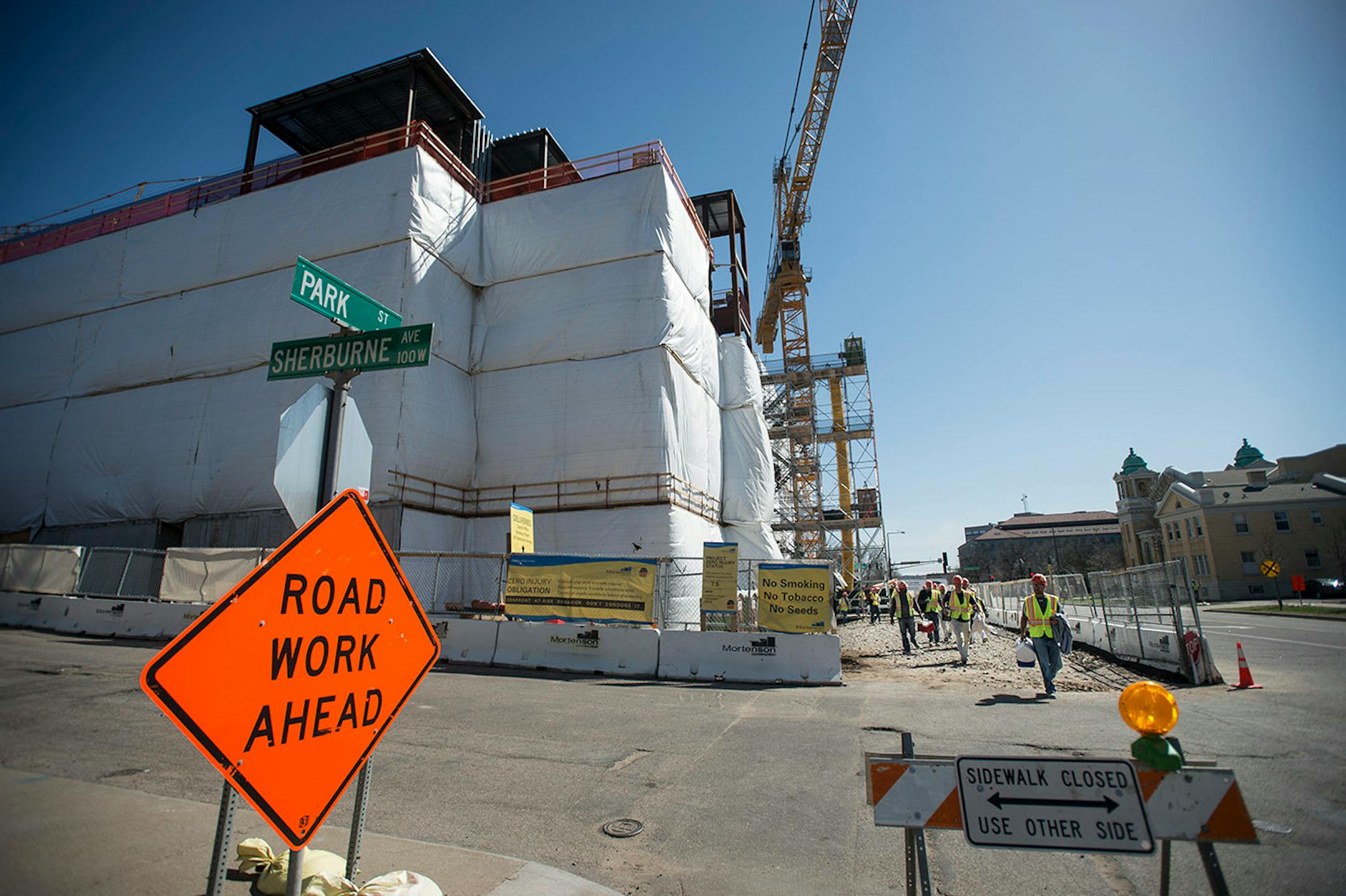 Workers leave the Senate Office Building construction site at the end of Tuesday's work day.