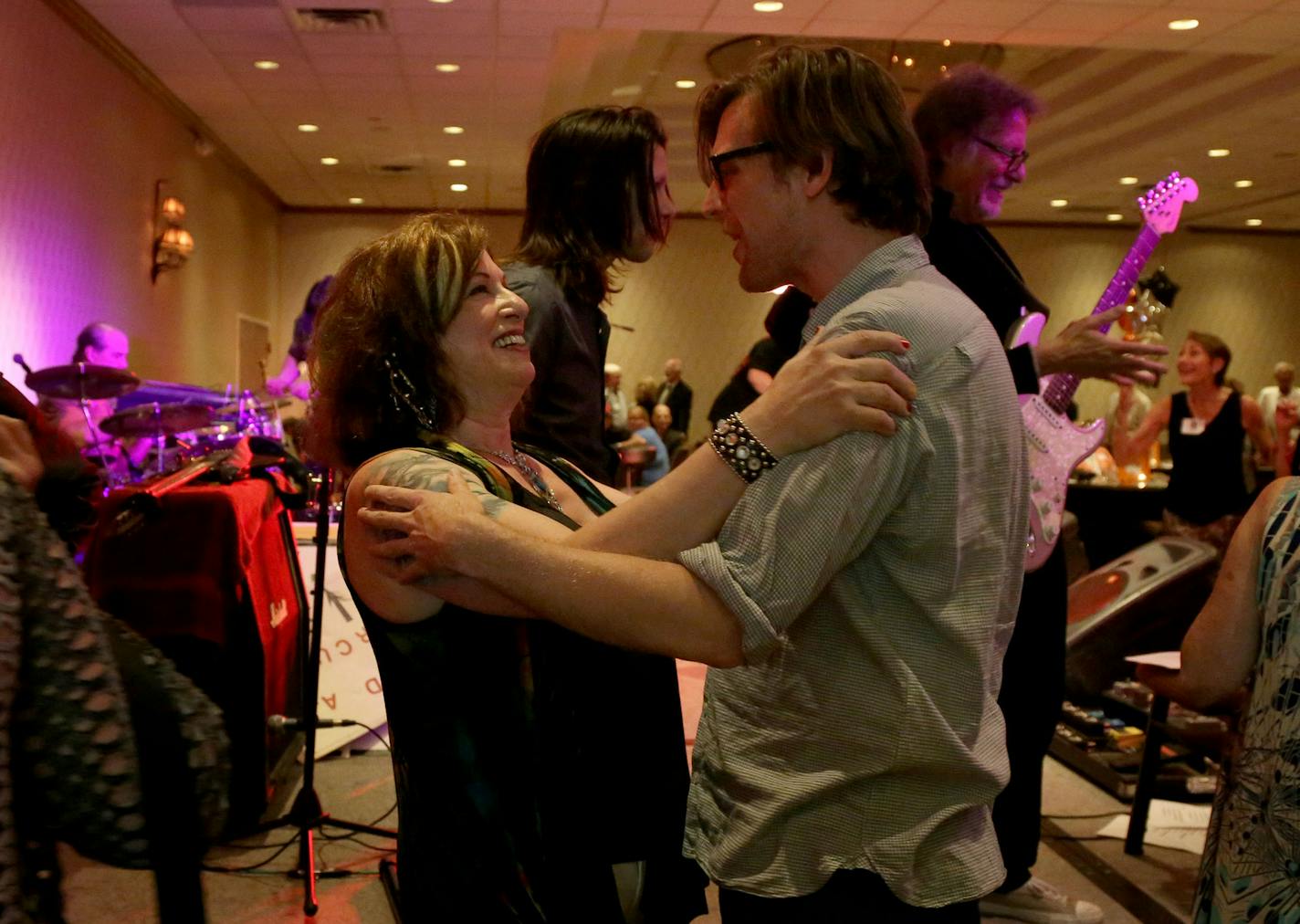 High Spirits lead singer Lauren Siegel embraced Jordan Husney, the son of her old bandmate Owen Husney, during the St. Louis Park Class of &#x2019;65 high school reunion last Saturday.