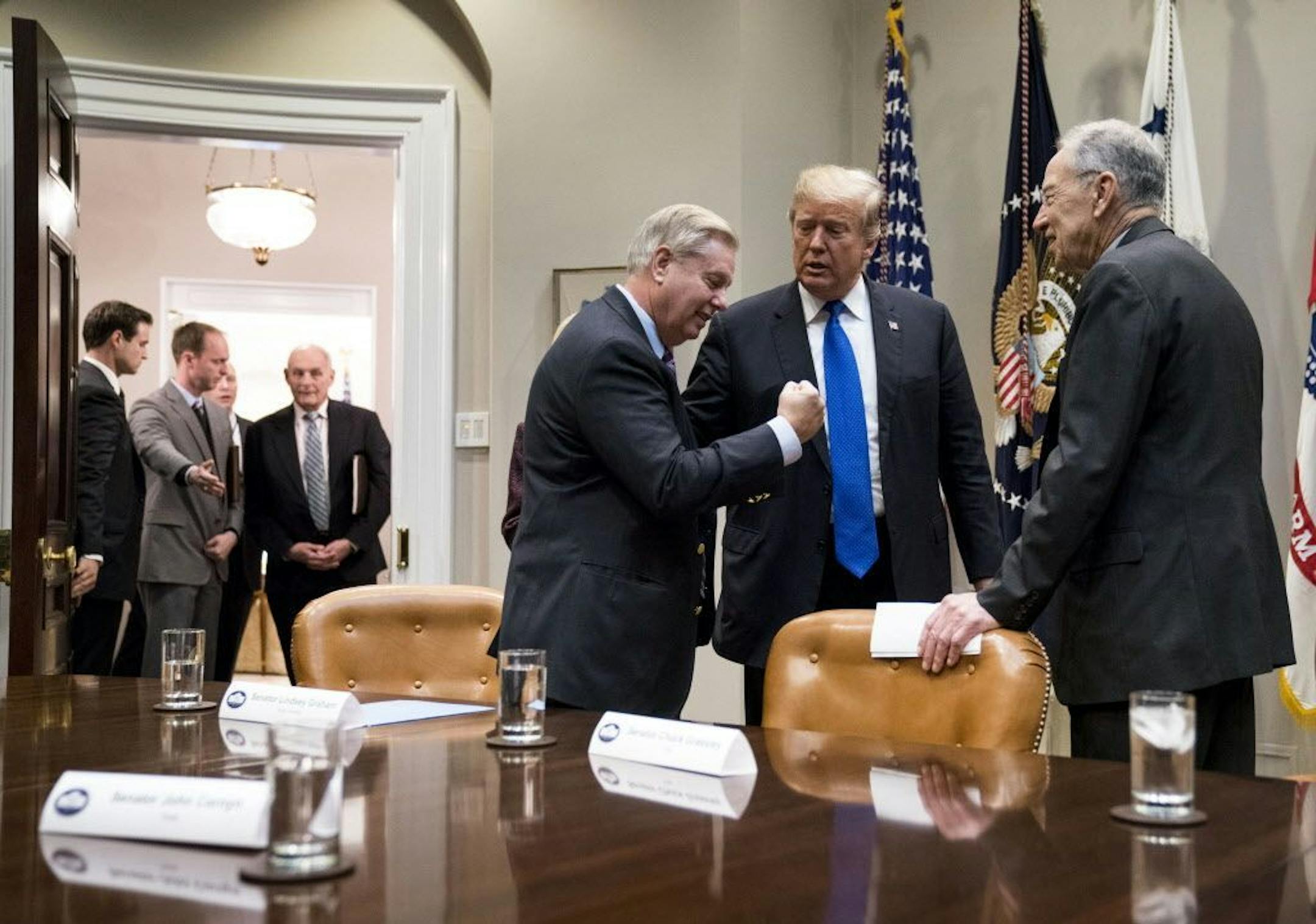 President Donald Trump speaks with Sen. Lindsey Graham (R-S.C.), left, and Sen. Chuck Grassley (R-Iowa) during a meeting on immigration the White House on Jan. 4, 2018.