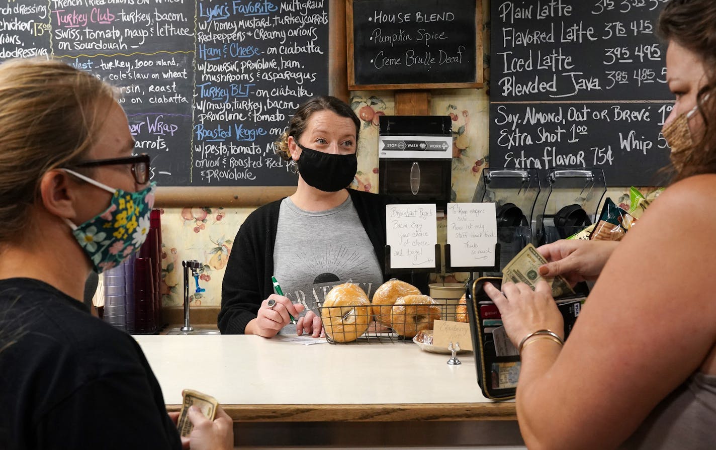 Ashlea Clifton, who moved from Minneapolis to take over the local coffee shop Gathering Grounds in August, took customers orders Wednesday morning. ] ANTHONY SOUFFLE • anthony.souffle@startribune.com Ken Nelson, founder of the Kenny's Candy Company, gave tour Wednesday, Oct. 7, 2020 of the town of Perham, Minn. where they make candy, potato chips and dog food, and their main problem is finding a place to put all the people who have jobs there.