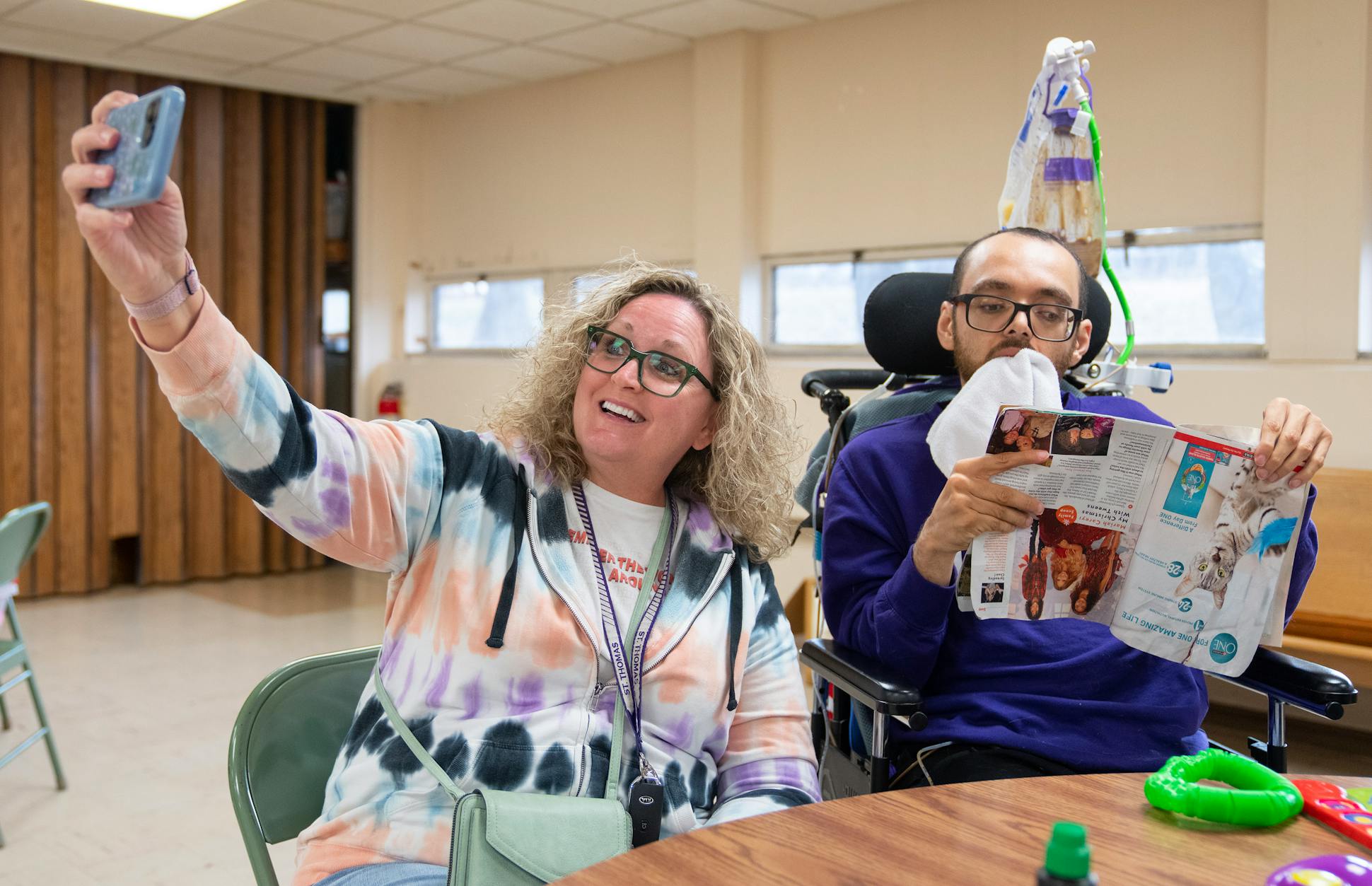 Kathy Ware takes a selfie with son Kylen during bingo night. Caring for him can be difficult, Kathy says, but she doesn't think of it “as a burden.” 
