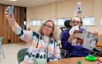 Kathy Ware takes a selfie with her son, Kylen, 29, at a bingo night for adults with developmental disabilities at First Presbyterian Church in St. Pau