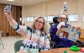 Kathy Ware takes a selfie with her son, Kylen, 29, at a bingo night for adults with developmental disabilities at First Presbyterian Church in St. Pau