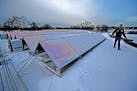 Terry Klapperick, the HVAC specialist for the city of Edina, showed how the new solar panels function on top of the Edina City Hall building, Friday, 