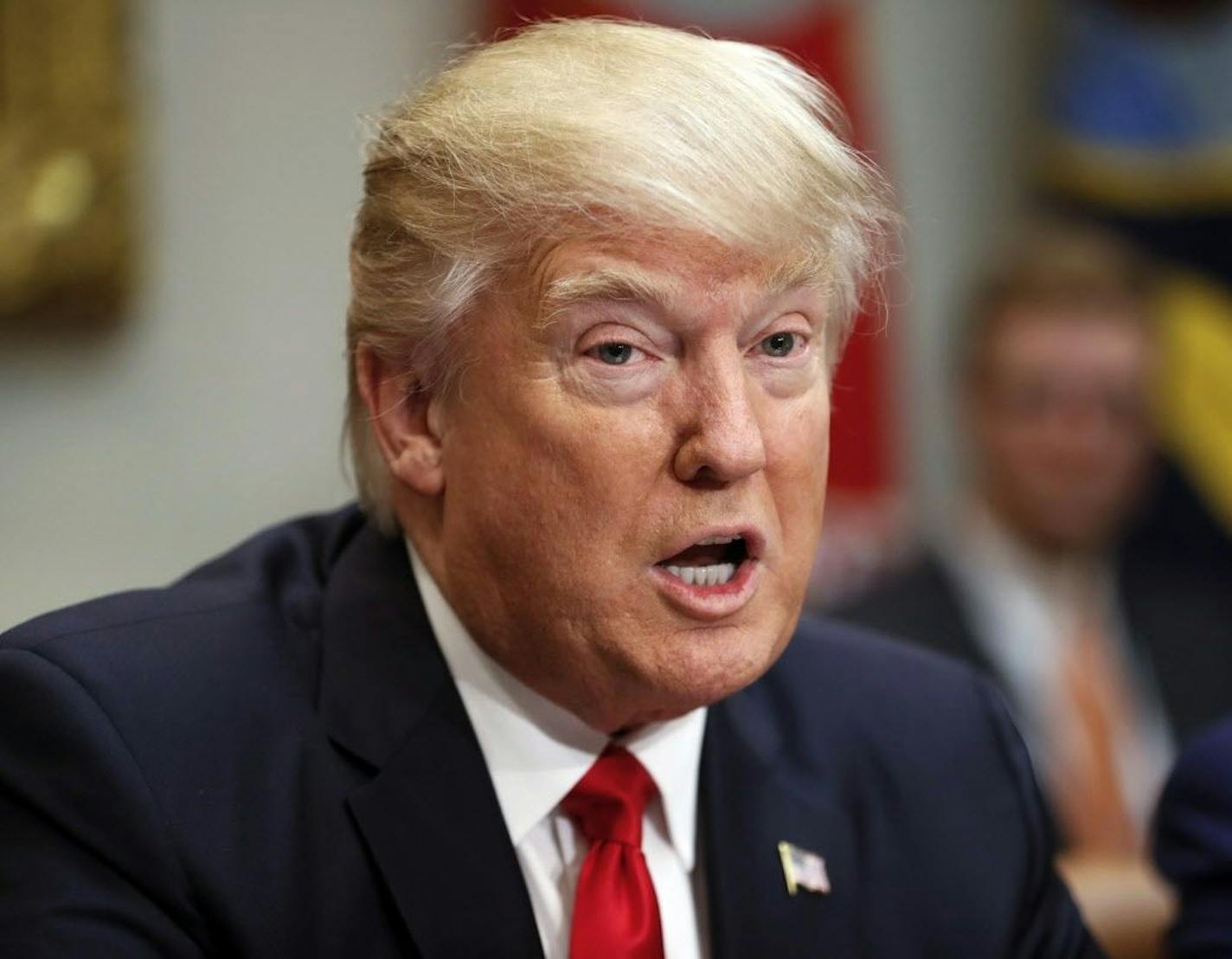 In this Feb. 2, 2017, photo, President Donald Trump speaks in the Roosevelt Room of the White House in Washington. Trump is taking his first steps aimed at scaling back financial services regulations. The president will sign an executive order Friday that will direct the Treasury secretary to review the 2010 Dodd-Frank financial oversight law, which reshaped financial regulation after the 2008-09 financial crisis.