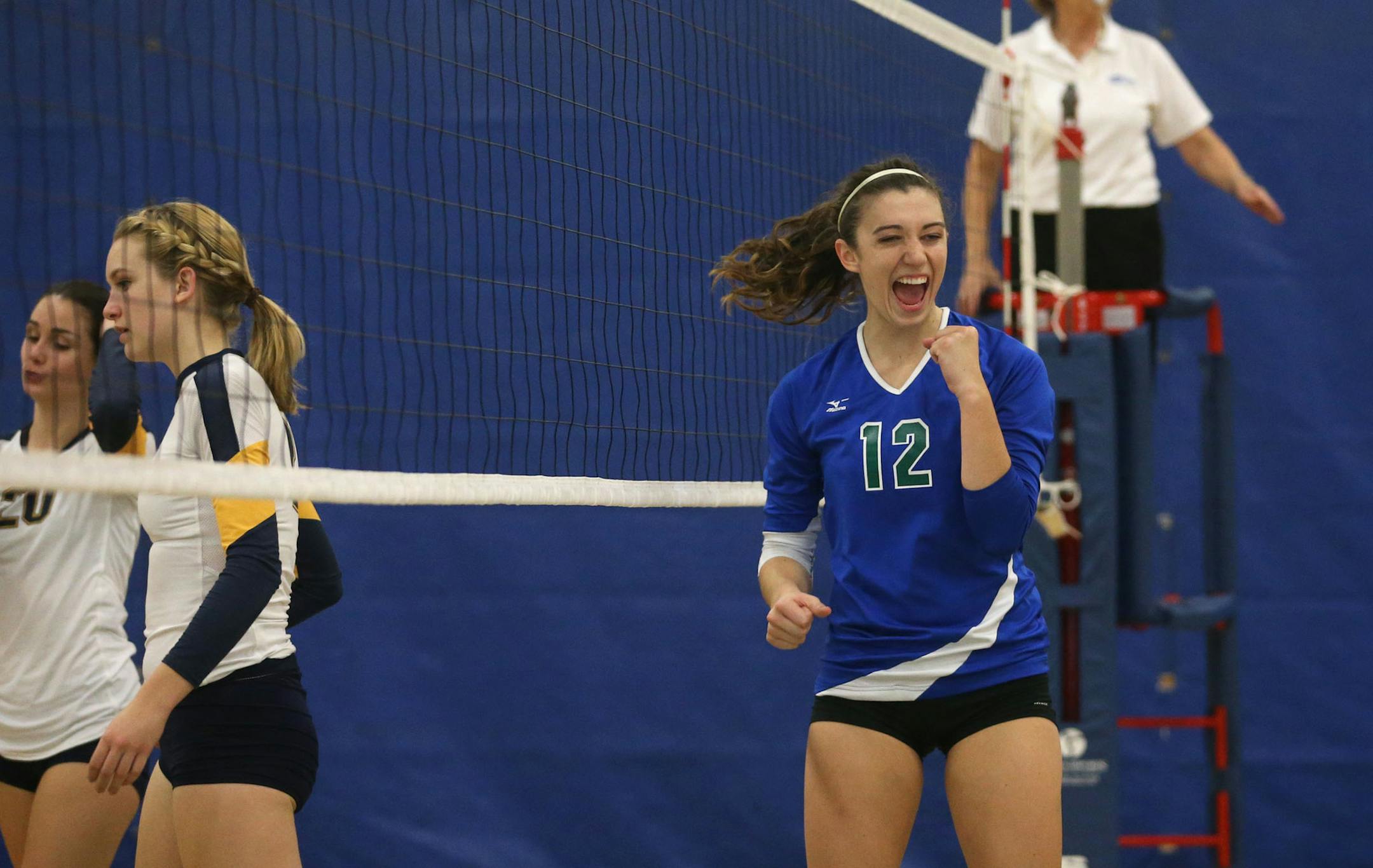 Eagan senior Celia Bertschl celebrated after her team scored a point during a game against Prior Lake in Eagan, Min., Tuesday, October 15, 2013 ] (KYNDELL HARKNESS/STAR TRIBUNE) kyndell.harkness@startribune.com