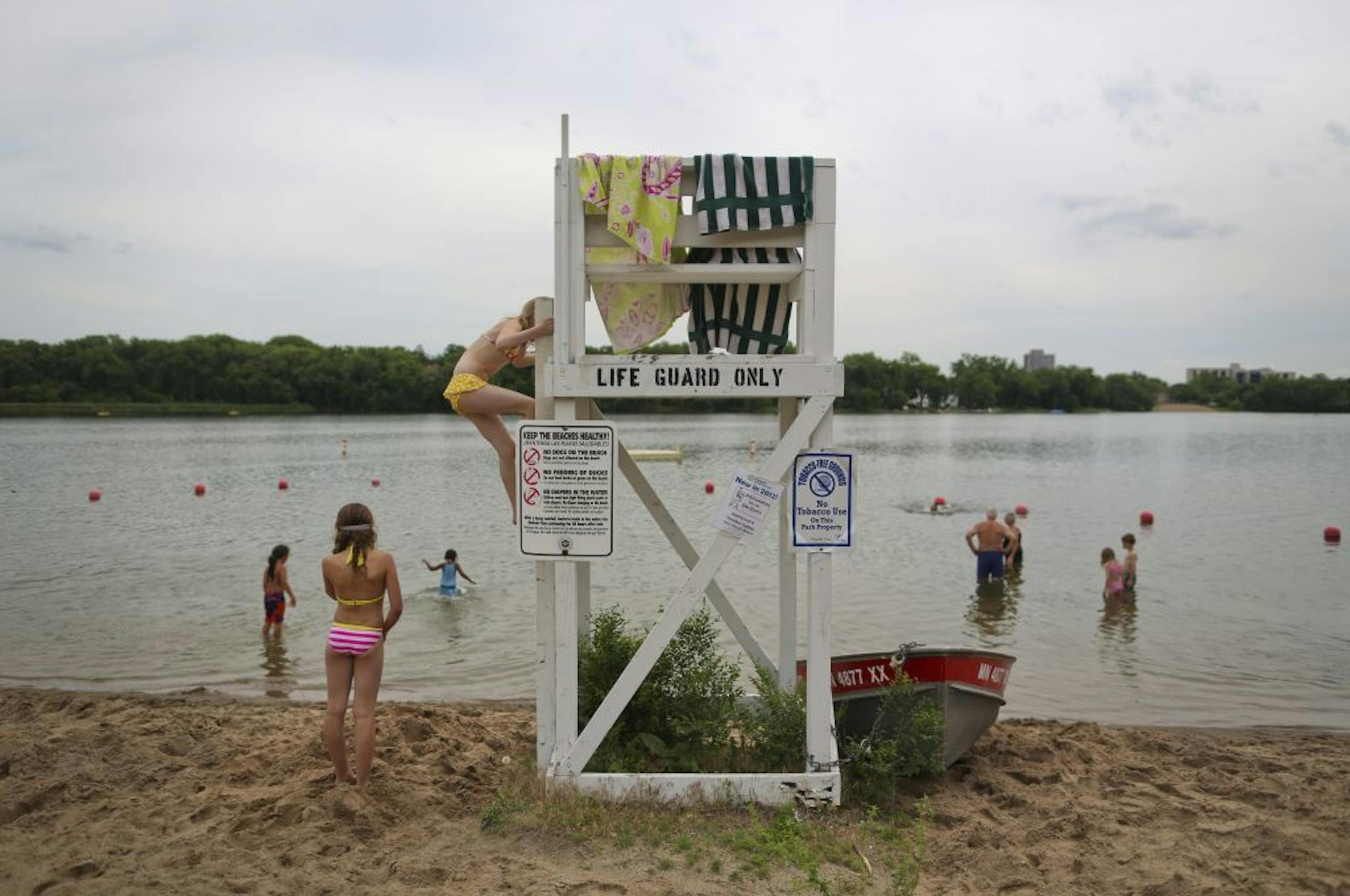 A life guard stand at a beach at Cedar Lake on Friday, June 15, in Minneapolis, Minn., remained without a lifeguard and was used by a couple girls as a place to dry their towels. On Sunday a 16-year-old girl drowned at this part of the lake.