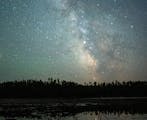 Planets Mars (left) and Saturn (center) shine brightly against the backdrop of the Milky Way above Fire Lake in the Boundary Waters Canoe Area.