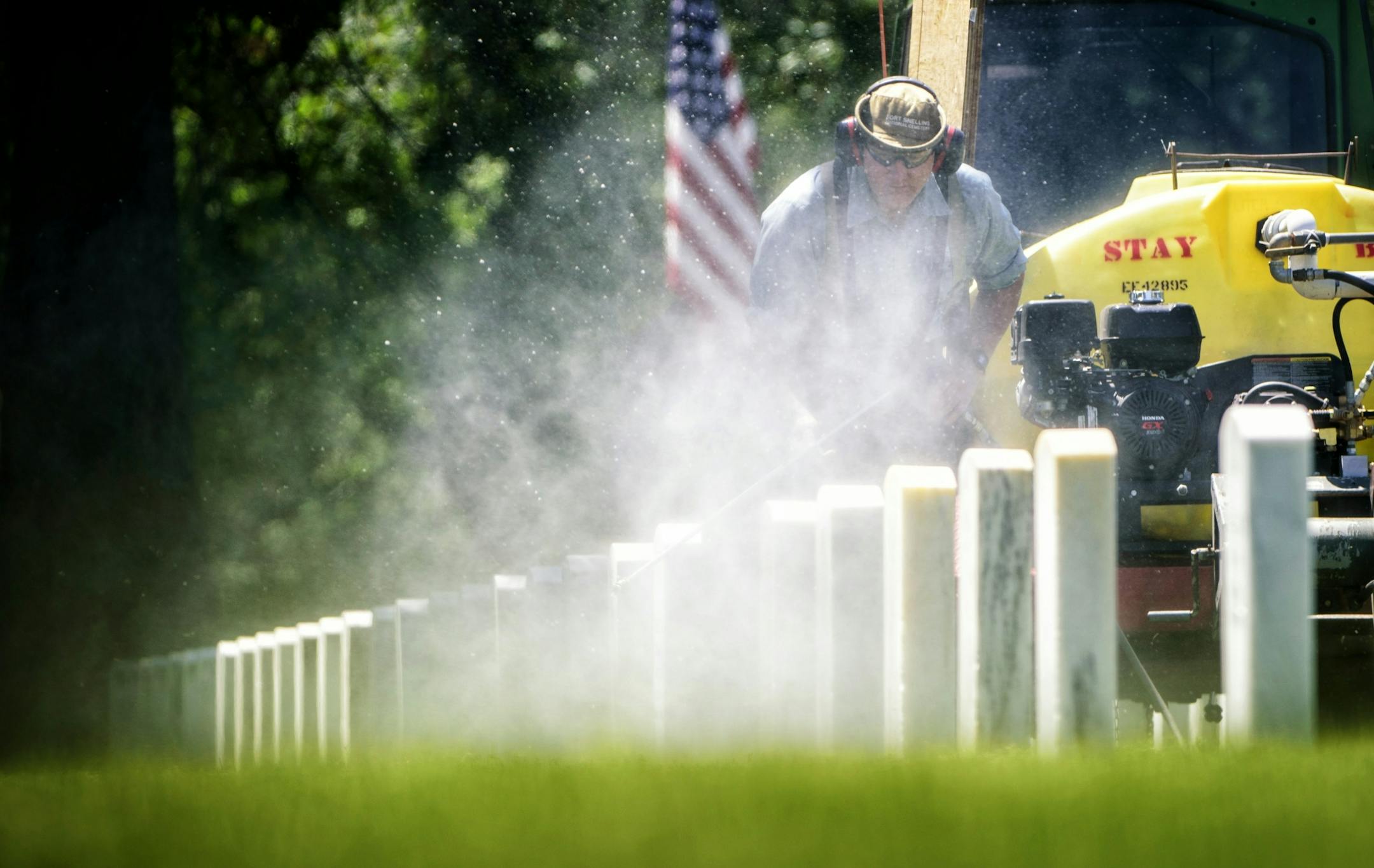 Power washing gravestones is a full time job for Mark Linafelter at Fort Snelling National Cemetery. He averages around 250 per day and around Memorial Day he focuses his attention to the ones under trees that need it the most to keep the place looking good for visitors.