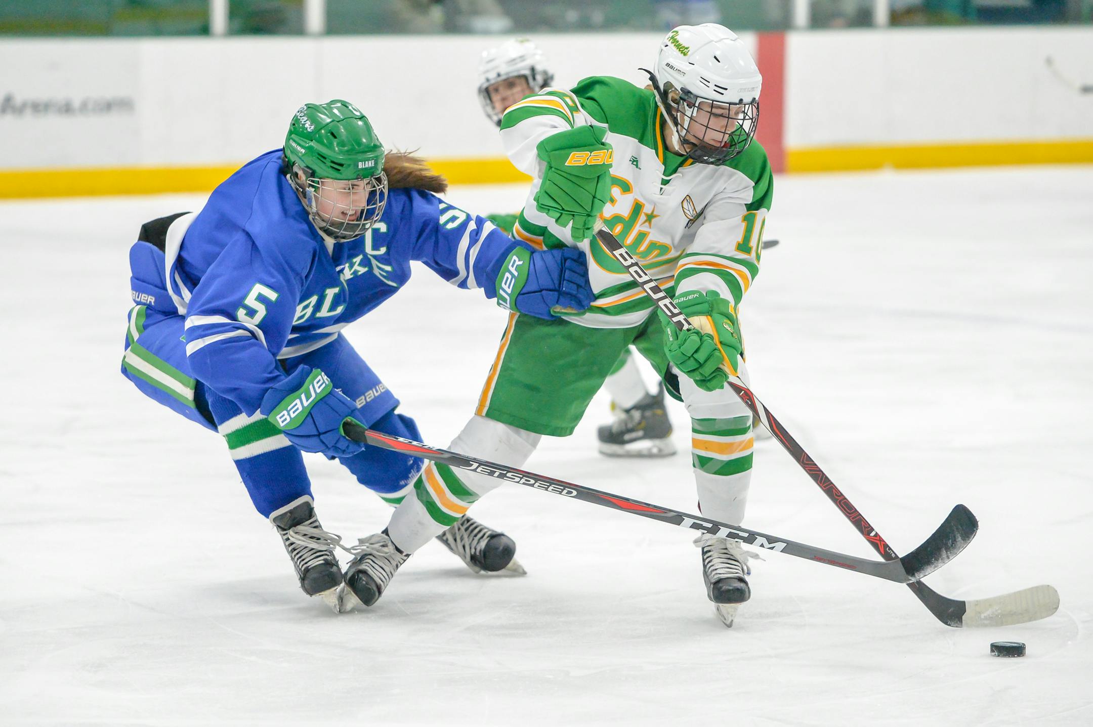 Blake's Madeline Wethington (5) battles Edina's Evelyn Adams (10) for the puck, Blake vs. Edina. January 18, 2019. Photo By Earl J. Ebensteiner, SportsEngine