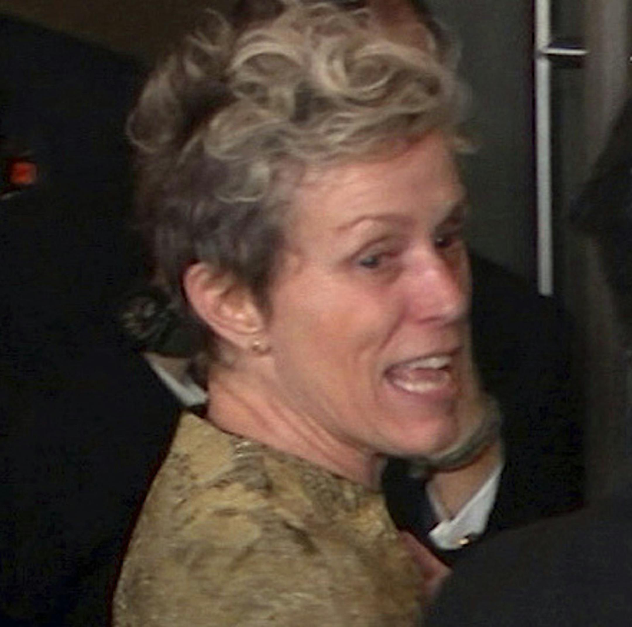 FILE - This March 4, 2018 file image taken from video shows Oscar winner Frances McDormand, foreground left, walking into the Governors Ball next to Terry Bryant, center, the man accused of stealing her Academy Award in Los Angeles. McDormand won the best actress category for her role in "Three Billboards Outside Ebbing, Missouri." On the day his trial was to begin, charges against Bryant have been dropped. Los Angeles County prosecutors said in court Tuesday, Aug. 20, 2019 that they were unable