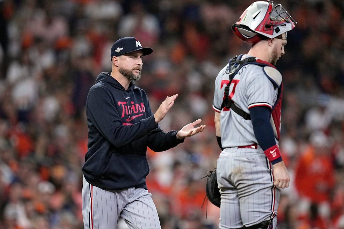 Minnesota Twins manager Rocco Baldelli makes a mound visit during the seventh inning in Game 1 of an American League Division Series baseball game against the Houston Astros, Saturday, Oct. 7, 2023, in Houston. (AP Photo/Kevin M. Cox)