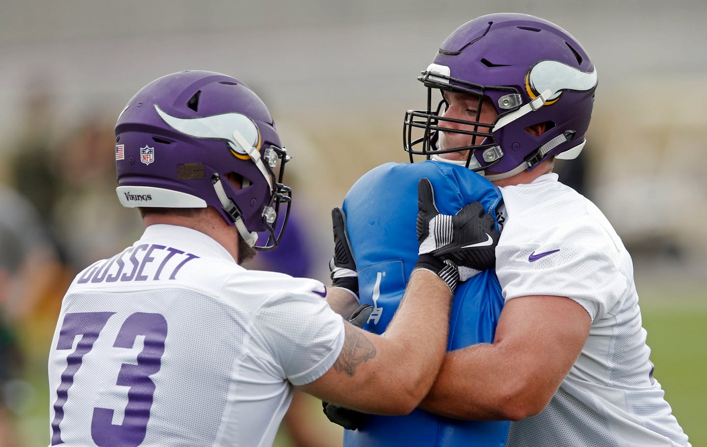 Minnesota Vikings guard Colby Gossett, left, and tackle Brian O'Neill run a blocking drill during the first day of training camp. O'Neill will make his fifth NFL start against the Bears on Sunday.