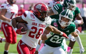 Jacksonville State running back Tre Stewart, since drafted by the Vikings, runs against Ohio in the Cure Bowl.