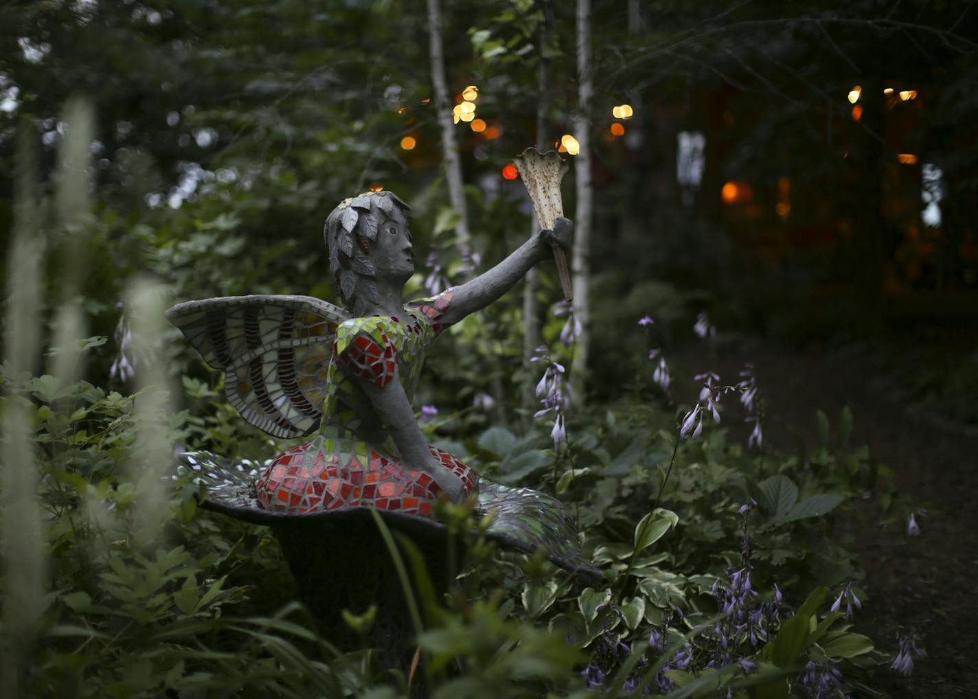 A fairy among hosta in Wouterina de Raad's garden last summer. ] JEFF WHEELER &#xef; jeff.wheeler@startribune.com Artist Wouterina de Raad's garden is a showcase for her concrete mosaic sculptures on her farm in Beldenville, WI. Her gardens were photographed Tuesday, July 29, 2014.