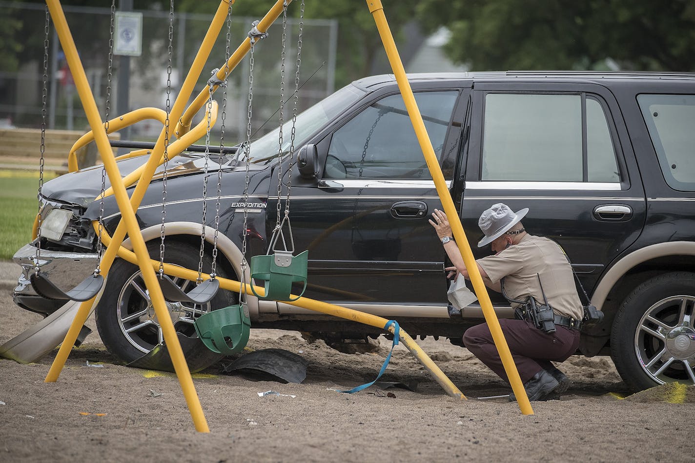 Minnesota State Patrol investigated the scene where a motorist being pursued by the State Patrol veered into a Minneapolis school playground and hit several children, Monday, June 11, 2018.