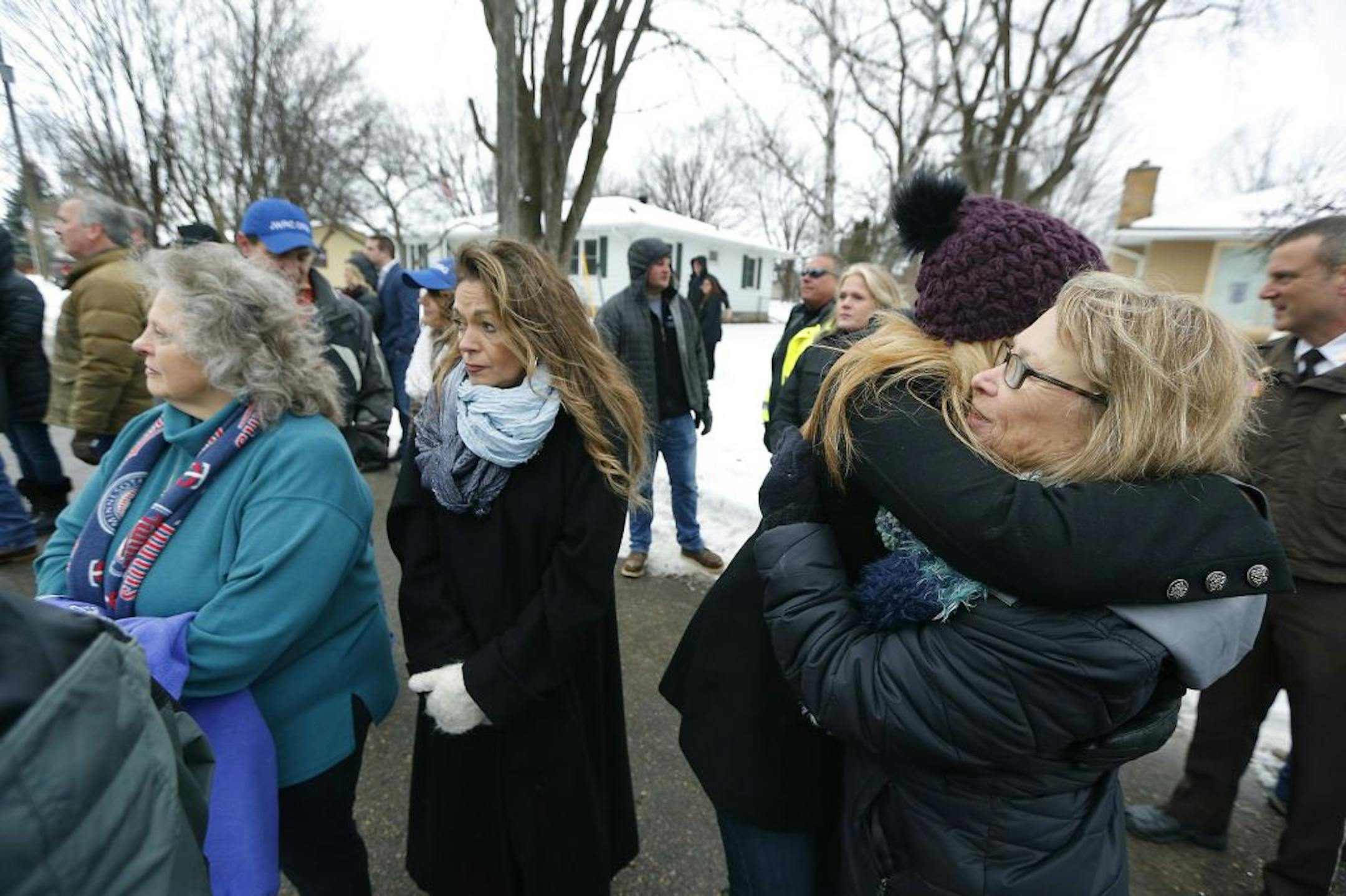 Patty Wetterling is comforted as she and a group of supporters watched as crew demolished the last trace of Jacob Wetterling's killer from the city of Annandale, Friday, December 23, 2016. The one-bedroom house on the corner lot once belonged to Danny Heinrich, Jacob Wetterling's killer. Last year, authorities searched it and discovered a trove of child pornography, surveillance videos of little boys at play, and the leverage they needed to coax Heinrich to confess that he was the one who snatch