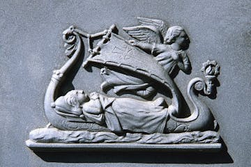 “The Last Voyage” bas relief plaque on the white bronze monument marking the graves of German and Barbara Friton in the Old Section of the New Ulm