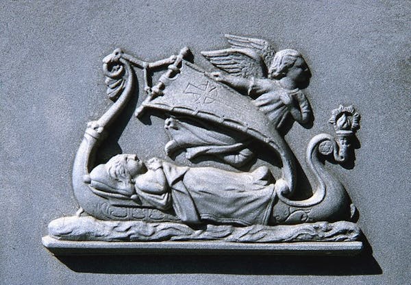 “The Last Voyage” bas relief plaque on the white bronze monument marking the graves of German and Barbara Friton in the Old Section of the New Ulm