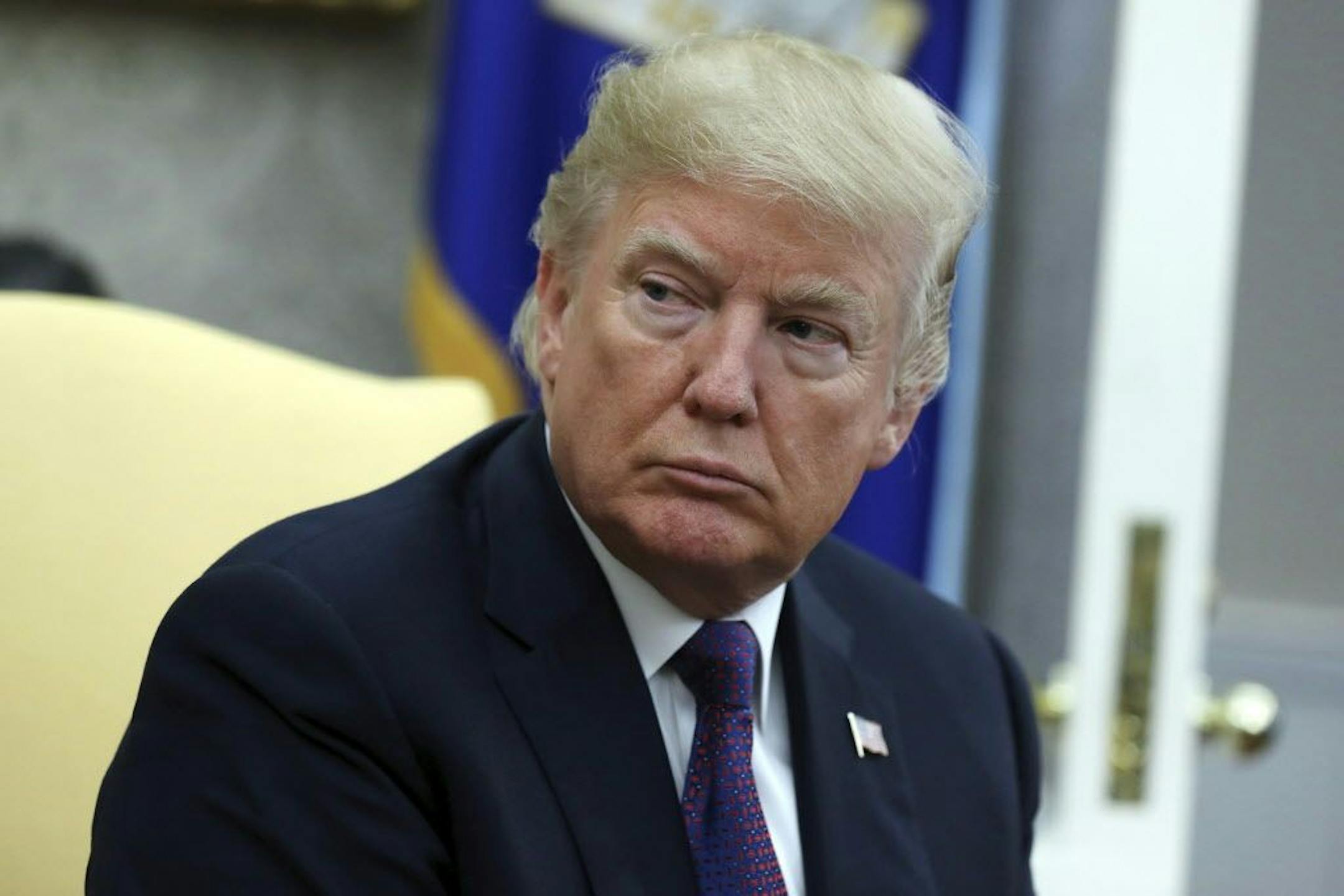 President Donald Trump listens during a meeting with Governor Ricardo Rossello of Puerto Rico in the Oval Office of the White House, Thursday, Oct. 19, 2017, in Washington.