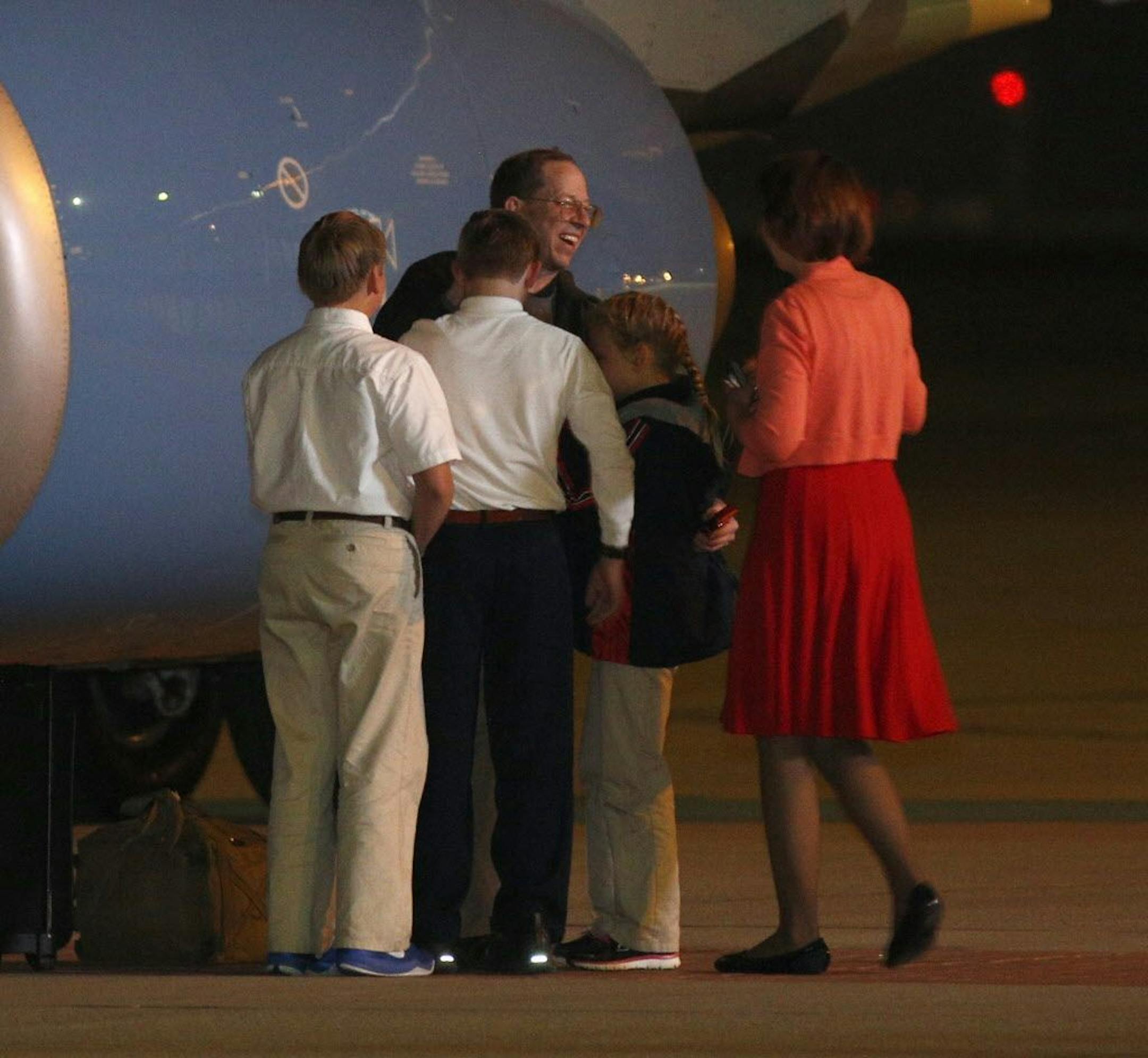 Jeffrey Fowle is greeted by family members on his arrival at Wright-Patterson Airforce Base, Wednesday morning, Oct. 22, 2014, in Dayton, Ohio.
