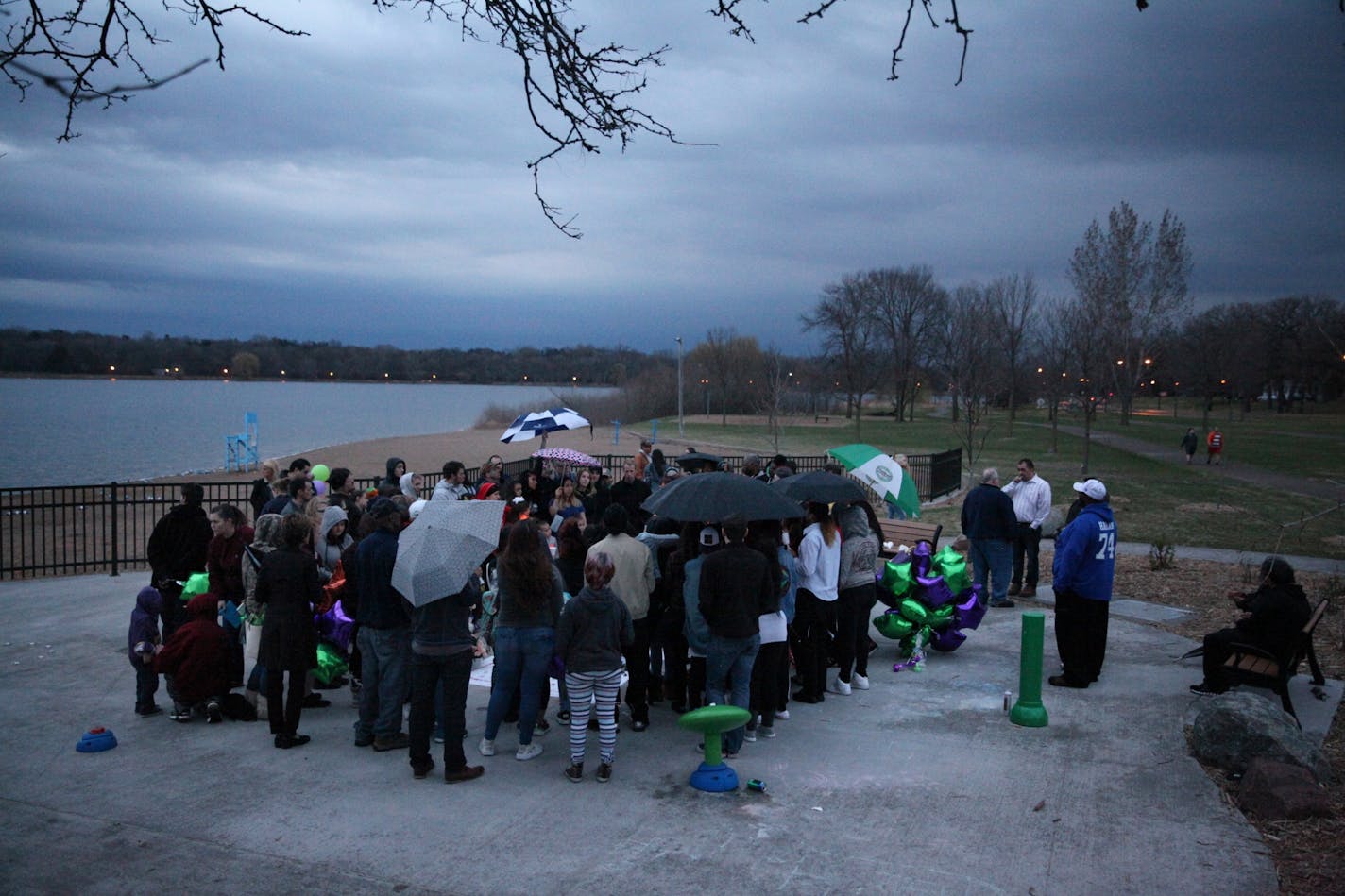 People gathered at a picnic area at Lake Phalen.