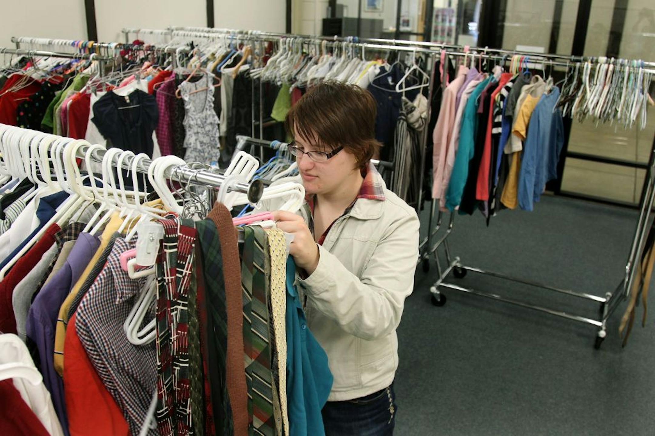 Emilie McKenzie, 18, sifted through clothing as she stocked incooming donation at Pathways, Thursday, September 27, 2012 in Coon Rapids, MN. The Pathways program is for students who need help transitioning out of high school (for a variety of reasons, especially special ed) is adding a professional clothes closet that any student in the district can access when they need an outfit for a job interview. Their teachers hope it can offer lessons in inventory, customer service, professional presentat