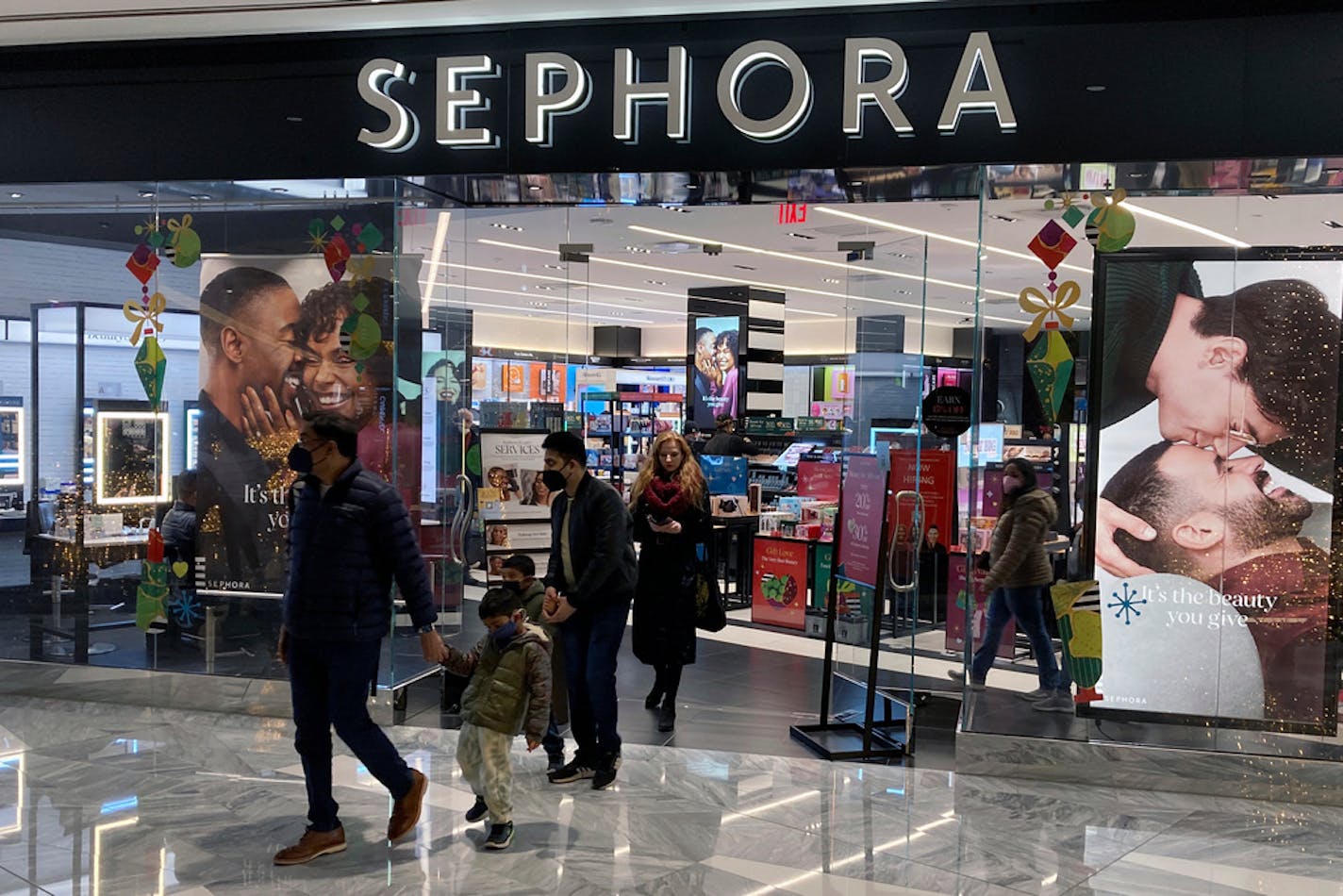 People leave a Sephora store in the Hudson Yards shopping mall in New York City.