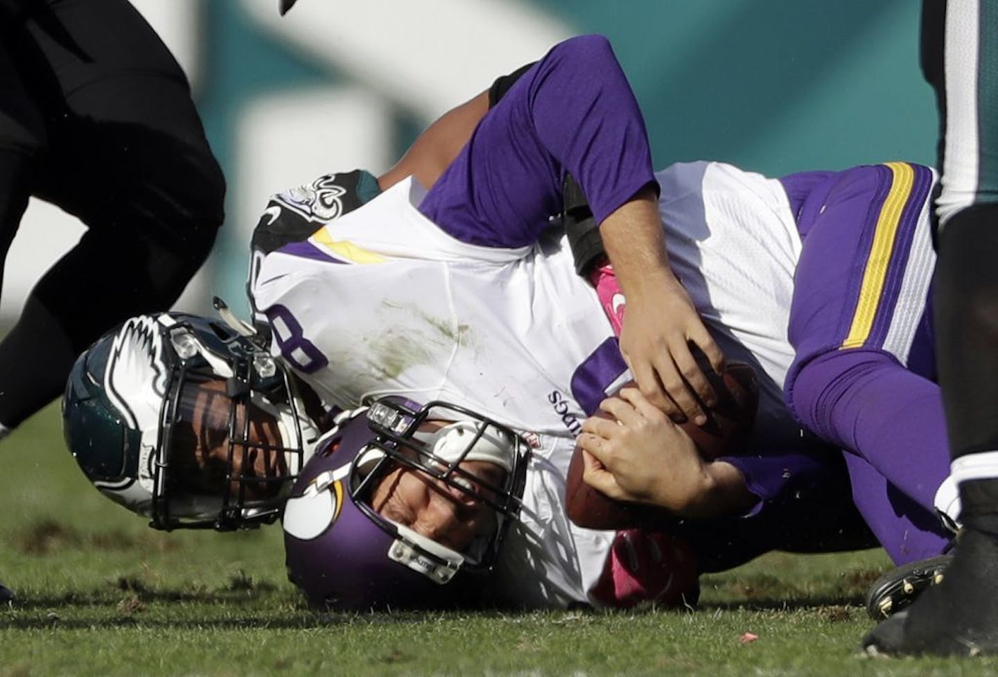 Vikings quarterback Sam Bradford was tackled by the Eagles' Jordan Hicks during the second half Sunday.