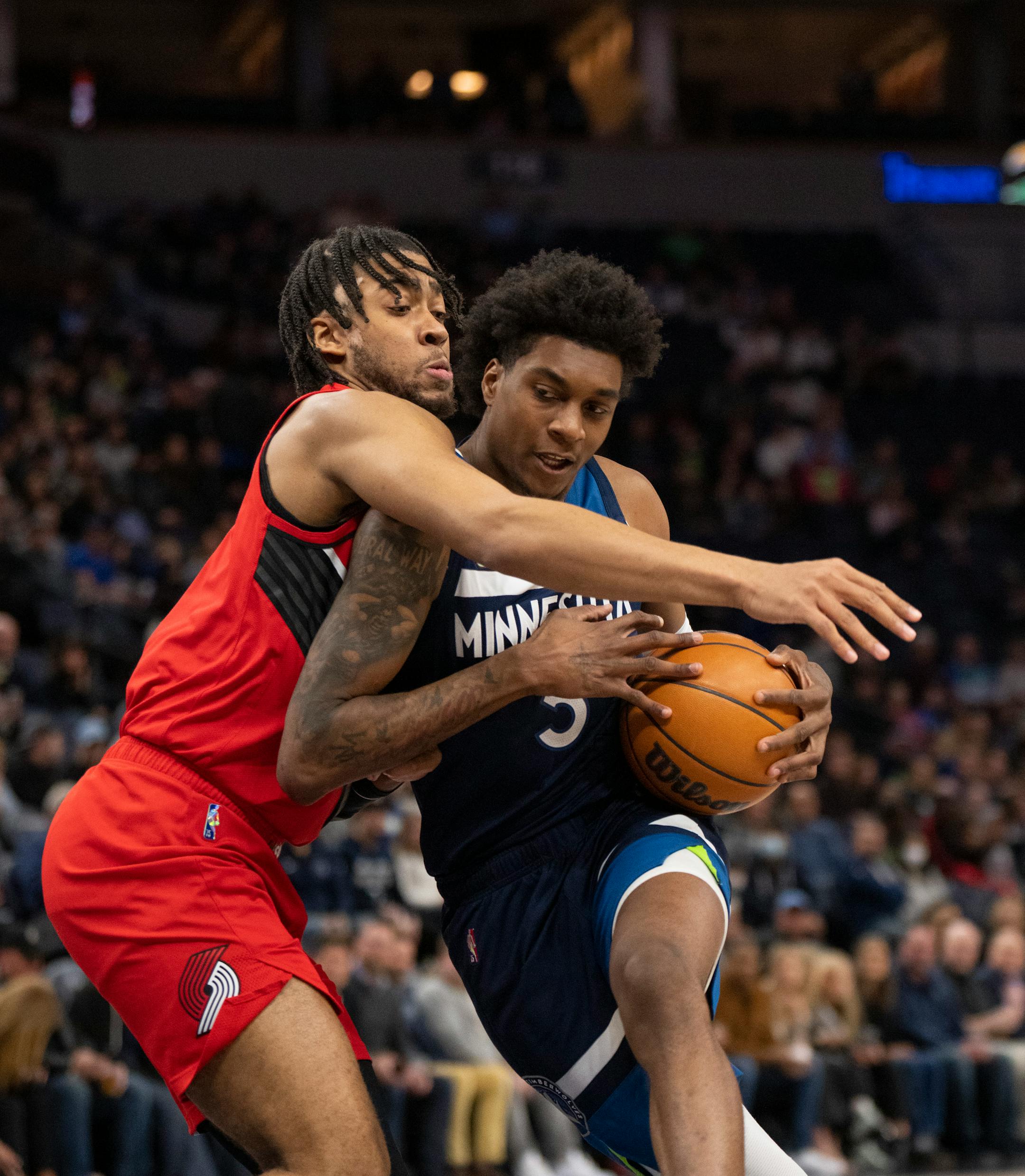 Minnesota Timberwolves guard Malik Beasley (5) was fouled by Portland Trail Blazers forward Trendon Watford (2) in the first quarter.