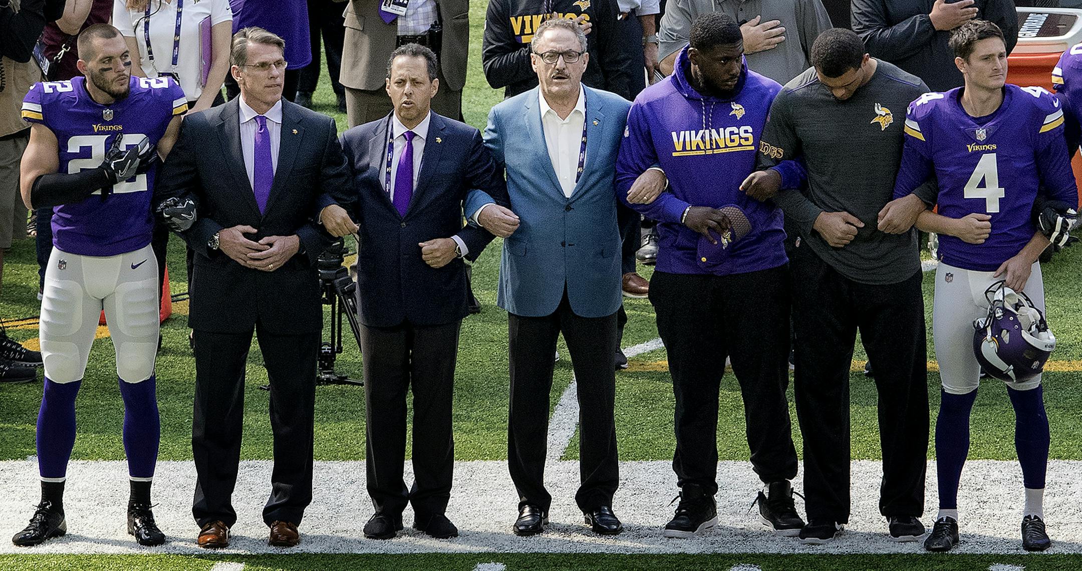 Minnesota Vikings general manager Rick Spielman, owners Mark Wilf and Zygi Wilf stood with players Harrison Smith (22) (left) during the National Anthem before the start of a game vs. the Tampa Bay Buccaneers at US Bank Stadium. ] CARLOS GONZALEZ &#xef; cgonzalez@startribune.com - September 24, 2017, Minneapolis, MN, NFL, US Bank Stadium, Minnesota Vikings vs. Tampa Bay Buccaneers ORG XMIT: MIN1709241256290326