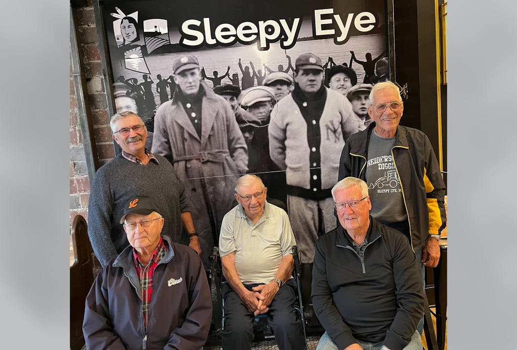 Baseball fans of Sleepy Eye (front row): Leon Tauer, left, Chisey Hansen and Pat Reynolds; (back row): Tom Hirsch, left, and Larry Heiderscheidt.