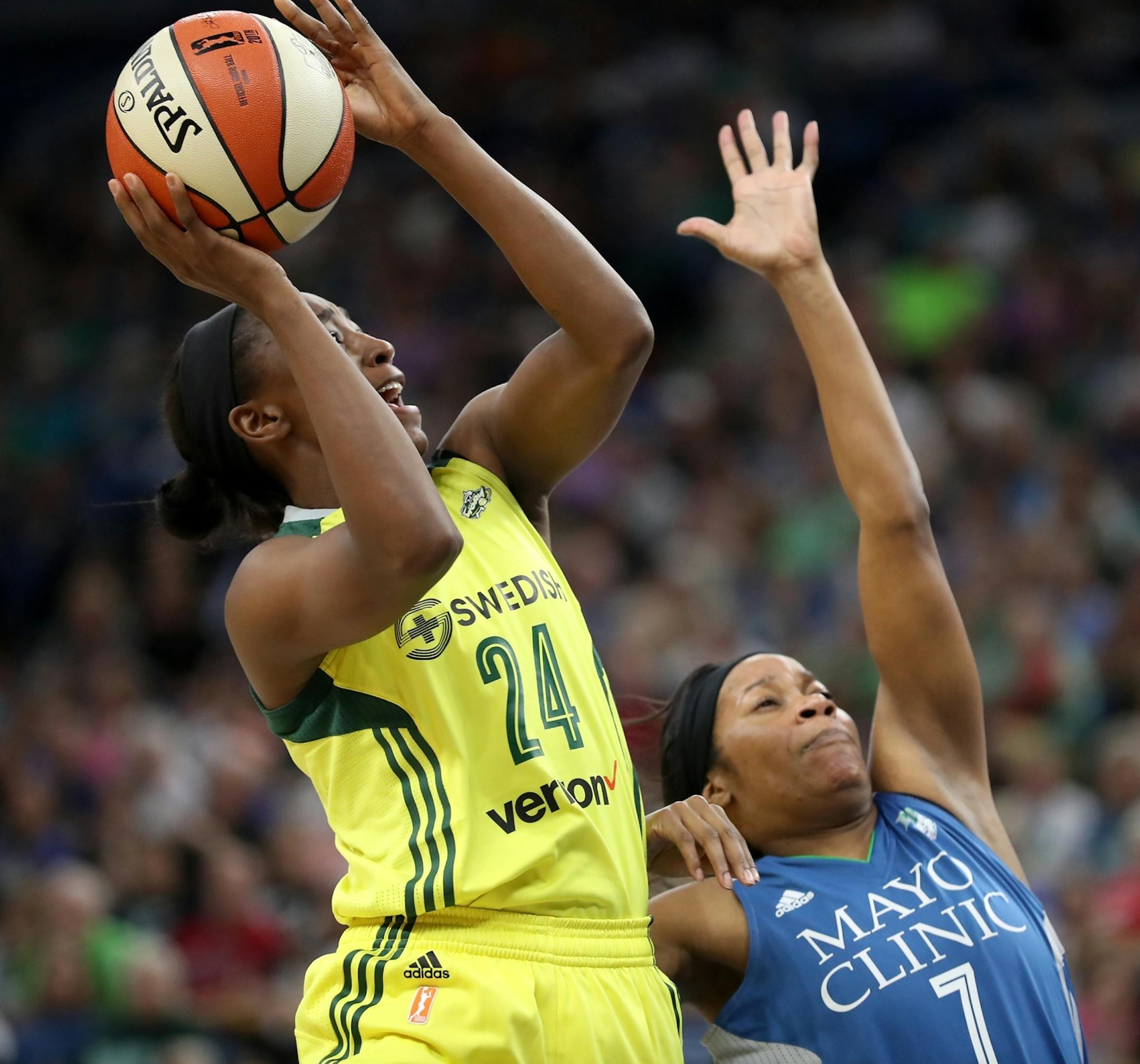 Seattle Storm guard Jewell Loyd (24) shoots against Minnesota Lynx guard Jia Perkins (7) during the first half.