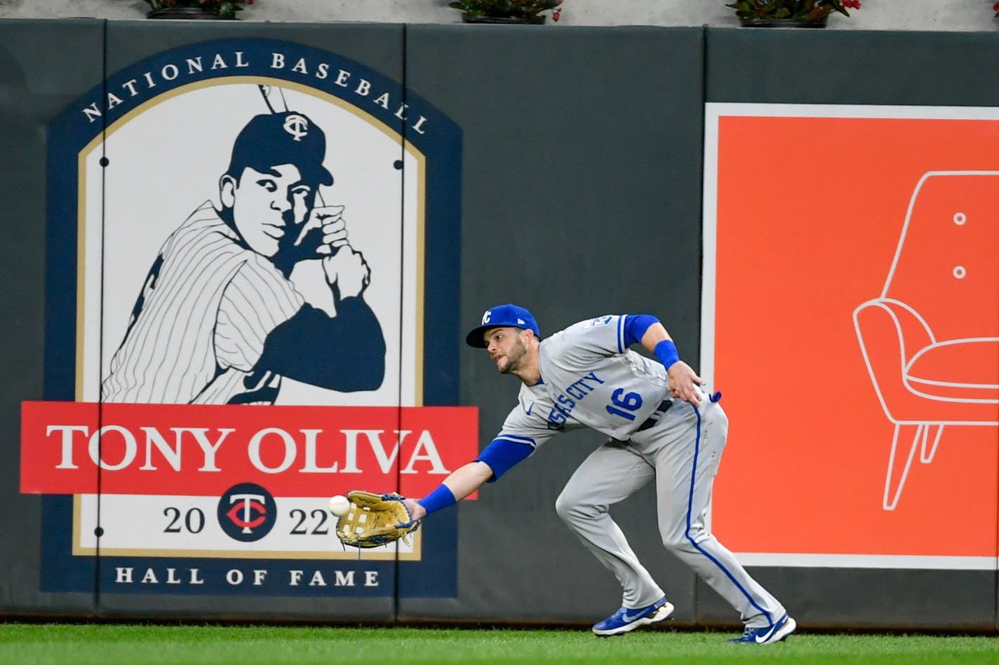 Kansas City Royals left fielder Andrew Benintendi catches a line drive hit by Minnesota Twins' Byron Buxton during the seventh inning of a baseball game Thursday, May 26, 2022, in Minneapolis. The Royals won 3-2. (AP Photo/Craig Lassig)