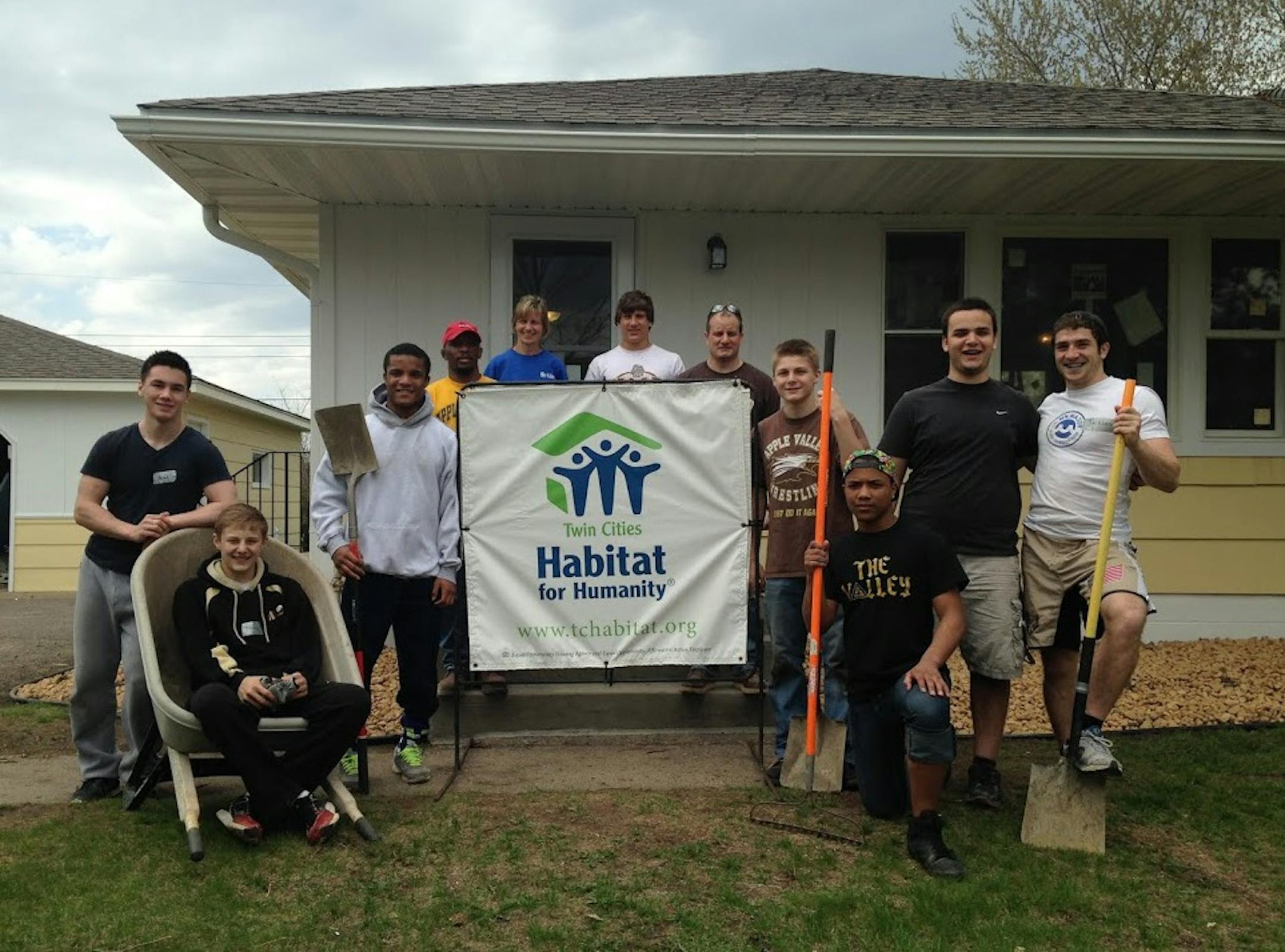 Members of the Apple Valley wrestling team worked on a Habitat for Humanity house in Brooklyn Park. May 2014