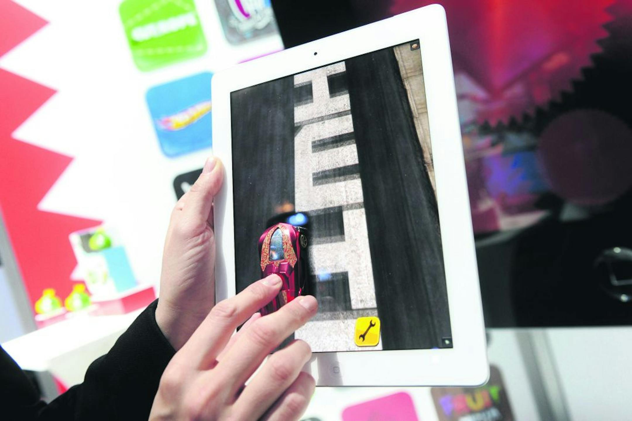 A Hot Wheels Apptivity vehicle interacts with the new Team Hot Wheels mobile app.