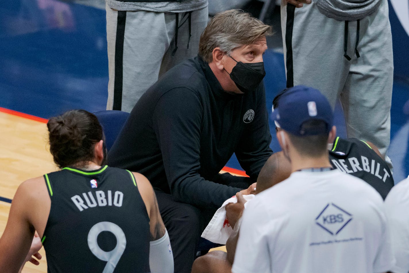 Minnesota Timberwolves coach Chris Finch talks with players during the first half of the team's NBA basketball game against the New Orleans Pelicans in New Orleans, Thursday, March 11, 2021. (AP Photo/Matthew Hinton)