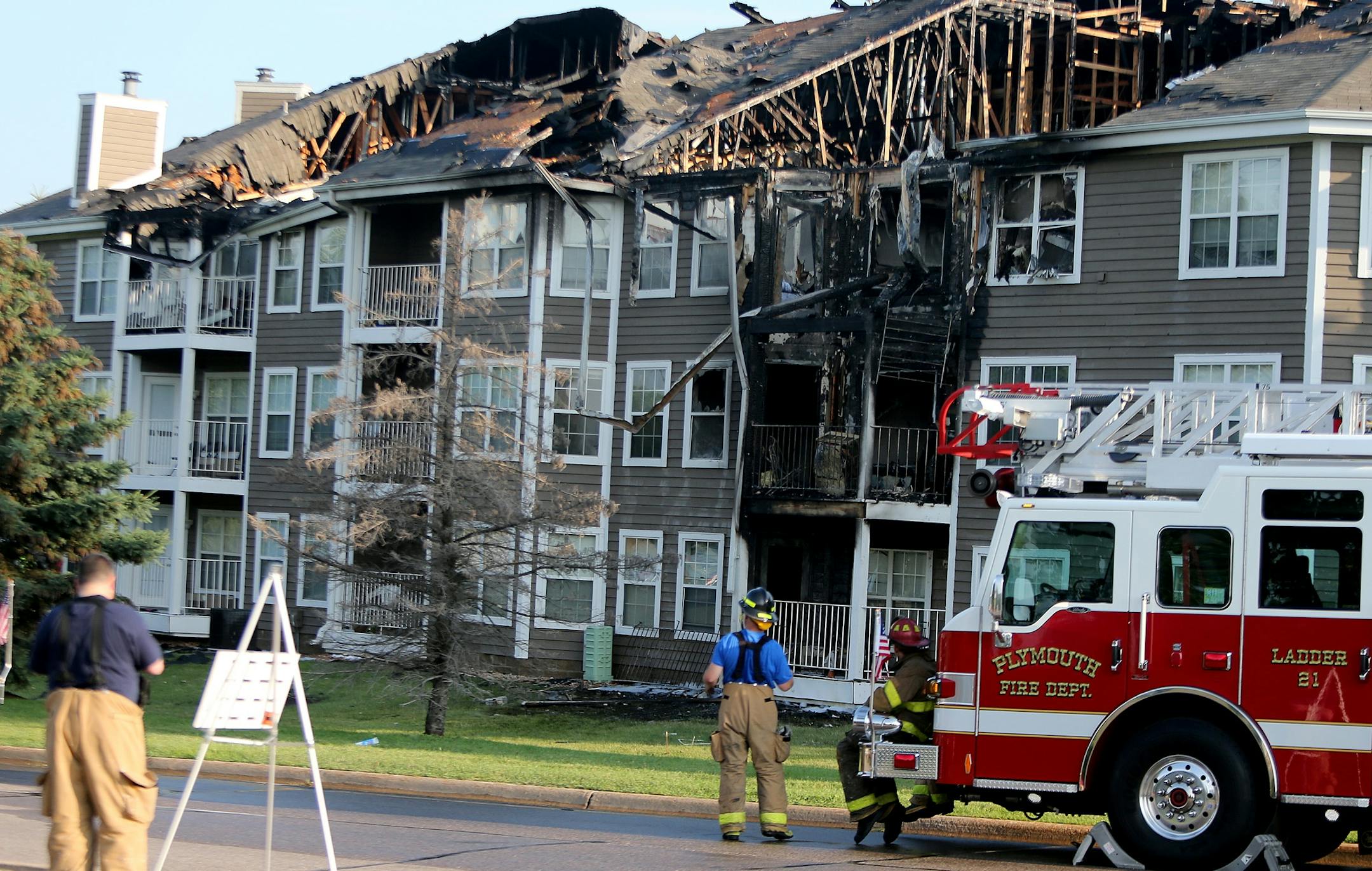 Plymouth firefighters worked the aftermath of an early morning fire at Vicksburg Village Apartments, Friday, July 12, 2013 in Plymouth, MN. (ELIZABETH FLORES/STAR TRIBUNE) ELIZABETH FLORES � eflores@startribune.com